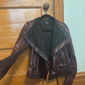 June 100% leather jacket, size small. knit ribbing on arms, cotton lining